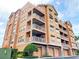 Three-story building with multiple balconies and attached garages at 7580 Toscana Blvd # 834, Orlando, FL 32819