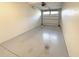 Empty garage with overhead door and concrete floor at 7580 Toscana Blvd # 834, Orlando, FL 32819