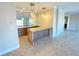 Modern kitchen featuring granite countertops and custom cabinetry at 7580 Toscana Blvd # 834, Orlando, FL 32819