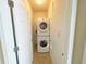 Convenient laundry closet with stacked washer and dryer at 7580 Toscana Blvd # 834, Orlando, FL 32819