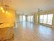 Spacious living room with tile floors and access to a balcony at 7580 Toscana Blvd # 834, Orlando, FL 32819