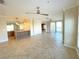Open living space with tile floors and a breakfast bar at 7580 Toscana Blvd # 834, Orlando, FL 32819