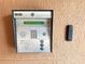 Wall-mounted security panel with keypad and key fob at 7580 Toscana Blvd # 834, Orlando, FL 32819