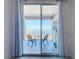 Private balcony with lake view and seating for two at 8737 The Esplanade # 65, Orlando, FL 32836