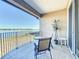 Spacious balcony with lake view and seating at 8737 The Esplanade # 65, Orlando, FL 32836