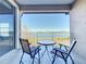 Lake view balcony with outdoor seating at 8737 The Esplanade # 65, Orlando, FL 32836