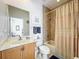 Updated bathroom with tub shower combo, vanity, and toilet at 8737 The Esplanade # 65, Orlando, FL 32836