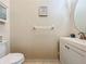 Small bathroom with toilet, vanity, and decorative wall art at 8737 The Esplanade # 65, Orlando, FL 32836