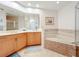 Bathroom boasts double vanities, a corner tub, and a shower at 8737 The Esplanade # 65, Orlando, FL 32836