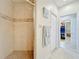 Spacious bathroom with shower stall and access to the walk-in closet at 8737 The Esplanade # 65, Orlando, FL 32836