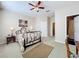 Spacious bedroom with ceiling fan, double bed, and ensuite bath at 8737 The Esplanade # 65, Orlando, FL 32836