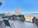 Wooden deck overlooking lake with seating for relaxing and enjoying the view at 8737 The Esplanade # 65, Orlando, FL 32836