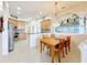 Dining area with wood table and chairs near kitchen and living room at 8737 The Esplanade # 65, Orlando, FL 32836