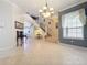 Grand two-story entryway with curved staircase and tile flooring at 8737 The Esplanade # 65, Orlando, FL 32836