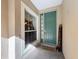 Inviting entryway with green door, welcome mat, and side window at 8737 The Esplanade # 65, Orlando, FL 32836
