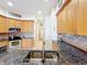 Kitchen with granite countertops and wood cabinets at 8737 The Esplanade # 65, Orlando, FL 32836
