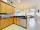 Kitchen features a breakfast bar, stainless steel appliances, and painted mural at 8737 The Esplanade # 65, Orlando, FL 32836
