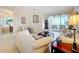 Living room with lake view and access to balcony at 8737 The Esplanade # 65, Orlando, FL 32836
