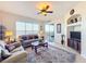 Living room with lake view, comfy seating, and plenty of natural light at 8737 The Esplanade # 65, Orlando, FL 32836