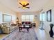 Relaxing living room with comfy sofas and view to a lake at 8737 The Esplanade # 65, Orlando, FL 32836