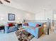 Relaxing loft area with seating and a view overlooking the lower floor at 8737 The Esplanade # 65, Orlando, FL 32836