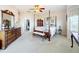 Main bedroom with a post bed, dresser and ensuite bathroom at 8737 The Esplanade # 65, Orlando, FL 32836