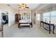 Main bedroom with a post bed and access to a walk-in closet at 8737 The Esplanade # 65, Orlando, FL 32836