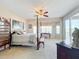Main bedroom with a post bed and lake view at 8737 The Esplanade # 65, Orlando, FL 32836