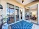 Sliding glass doors lead to a serene patio with lake views at 8737 The Esplanade # 65, Orlando, FL 32836