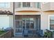 Screened porch with lake view and seating at 8737 The Esplanade # 65, Orlando, FL 32836