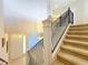 Elegant staircase with wrought iron railing and carpet at 8737 The Esplanade # 65, Orlando, FL 32836