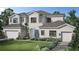Two-story home with attached garage and landscaping at Lot 33 Yellowleaf Cir, Orlando, FL 32820