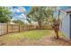 Simple backyard with a wooden fence and grass at 100 Kelly Cir, Sanford, FL 32773