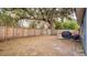 Spacious backyard with wooden fence, hammock, and grill at 100 Kelly Cir, Sanford, FL 32773