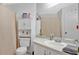 Simple bathroom with a white toilet and vanity at 100 Kelly Cir, Sanford, FL 32773