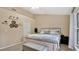 Spacious bedroom with a king-size bed and window at 100 Kelly Cir, Sanford, FL 32773