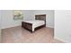 Simple bedroom with a double bed and ample floor space at 100 Ledbury Dr, Longwood, FL 32779