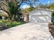 The property boasts a long driveway leading to the garage at 100 Ledbury Dr, Longwood, FL 32779