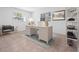 Bright home office features a desk, chair, and ample natural light at 100 Ledbury Dr, Longwood, FL 32779