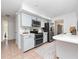 Modern kitchen with stainless steel appliances and white cabinets at 100 Ledbury Dr, Longwood, FL 32779