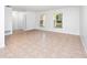 Bright and airy living room with tile floors and access to other rooms at 100 Ledbury Dr, Longwood, FL 32779