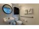 Small bathroom with toilet, sink, and grab bars at 1001 Park Ridge Cir, Kissimmee, FL 34746