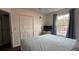 Bedroom with queen bed and window views at 1001 Park Ridge Cir, Kissimmee, FL 34746