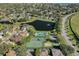 Aerial view of community pool and tennis courts at 10125 Canopy Tree Ct, Orlando, FL 32836