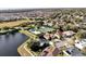 Aerial view of community with pool, tennis courts at 10125 Canopy Tree Ct, Orlando, FL 32836