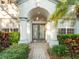 Elegant entryway with double doors and arched detail at 10125 Canopy Tree Ct, Orlando, FL 32836