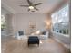 Relaxing living area with comfortable seating and large windows at 10125 Canopy Tree Ct, Orlando, FL 32836