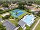 An aerial view of a community pool and tennis courts at 10125 Canopy Tree Ct, Orlando, FL 32836