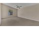 Bright bedroom featuring a window and carpet flooring at 1101 Swanson Dr, Deltona, FL 32738