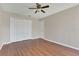 Bedroom with hardwood floors, double door closet and ceiling fan at 1101 Swanson Dr, Deltona, FL 32738